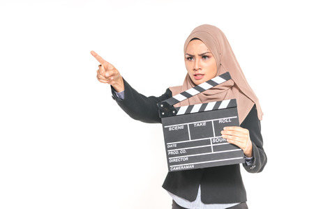 Hijab girl holding a clapper board. Filmmaking or film production conceptの写真素材