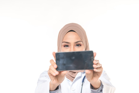 Hijab medical doctor use a phone. Healthy concept.の写真素材