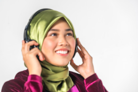 Veiled teenager and headset with entertaiment concept.の写真素材