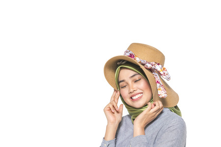 Veiled teenager with white background.