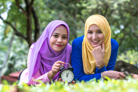 Veiled teenager with muslimah lifestyle concept at green garden.の写真素材