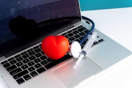 Stethoscope and laptop with medical insurance concept.の写真素材