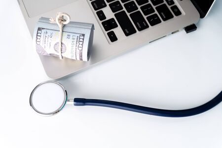 Stethoscope and laptop with medical insurance concept.