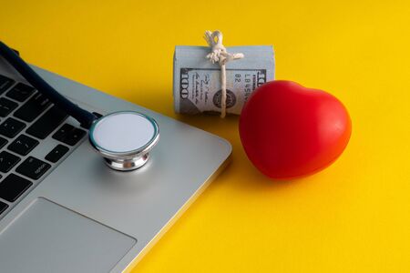 Stethoscope and banknotes with medical insurance concept.