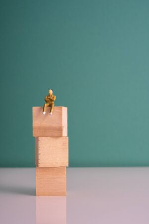 Wooden cube stacking with green background.の写真素材