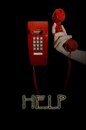 Hand holding up red phoneの写真素材