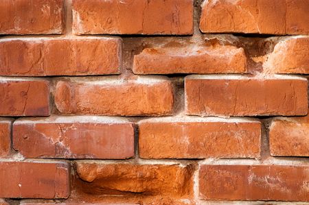 Aging highly textured brick wall suitable for background