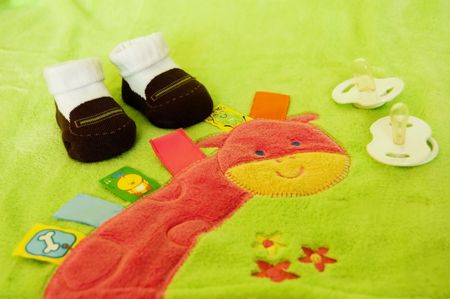 Essential children's accessories on green background , for each baby の写真素材