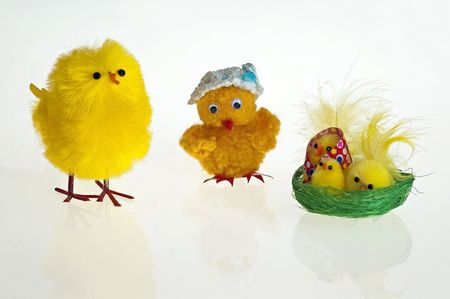 Easter background with decorative chickens in a nestの写真素材