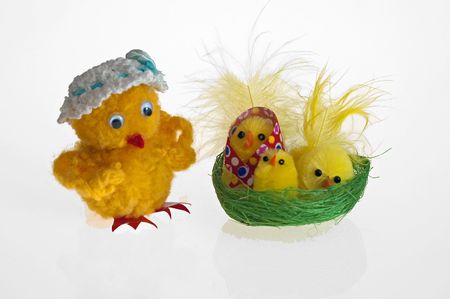 Easter background with decorative chickens in a nestの写真素材