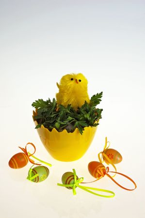Easter background with decorative chickens in the eggの写真素材