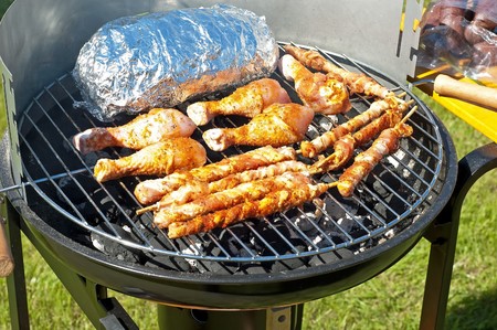 Grilling meat at summer weekendの写真素材
