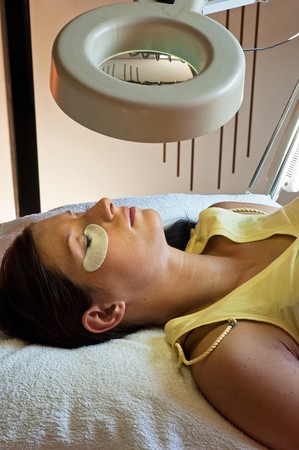 prolonging and supplementing eyelashes in a beauty salonの写真素材