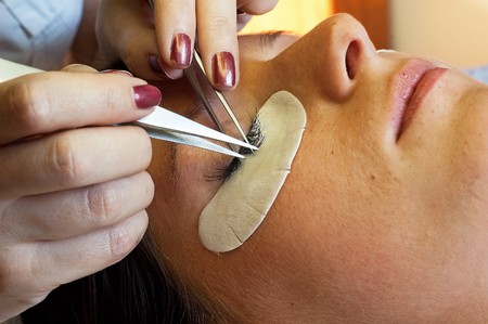 prolonging and supplementing eyelashes in a beauty salonの写真素材