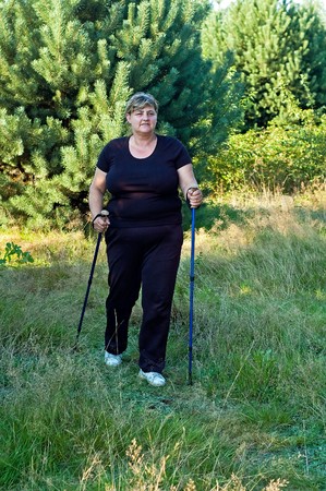 Young planting woman nordic all over forestの写真素材