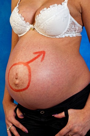 Pregnant woman  on the blue mosaic backgroundの写真素材