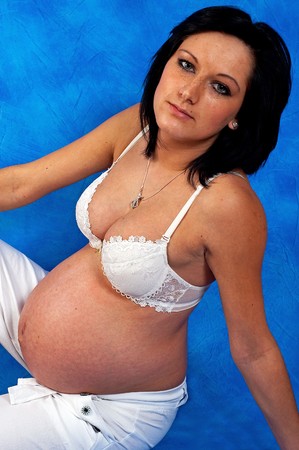 Pregnant woman on the blue mosaic backgroundの写真素材