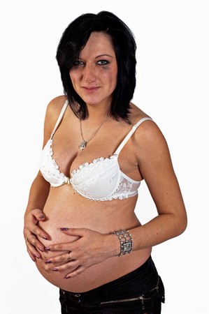 Crying pregnant woman on the white background の写真素材