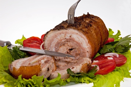 roast pork in tomatoes on the white backgroundの写真素材