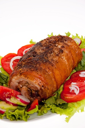 roast pork in tomatoes on the white backgroundの写真素材