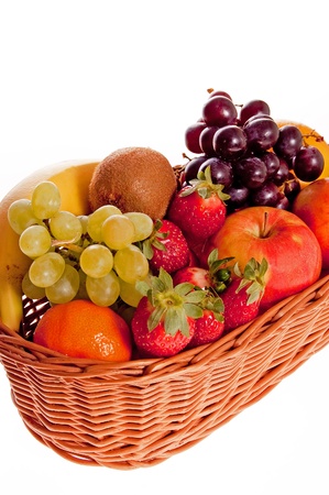 Various fresh ripe fruits placed in a wicker basketの写真素材