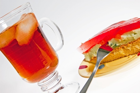 Iced tea and cake dessert with a red jellyの写真素材