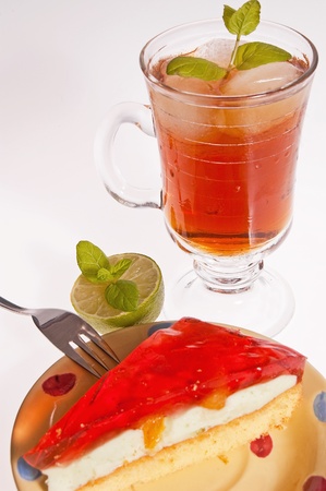 Iced tea and cake dessert with a red jellyの写真素材