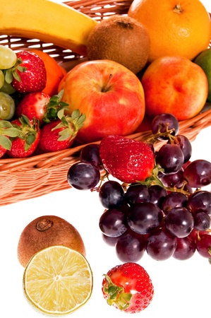 Various fresh ripe fruits placed in a wicker basketの写真素材