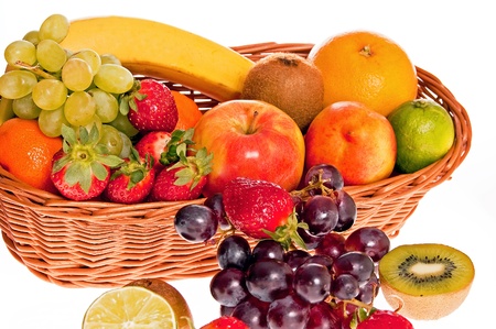 Various fresh ripe fruits placed in a wicker basketの写真素材