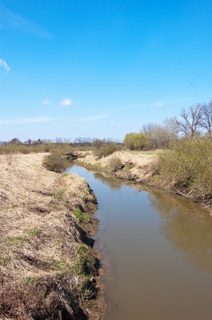dirty, muddy river and the landscape after the flooding in southern Polandの写真素材