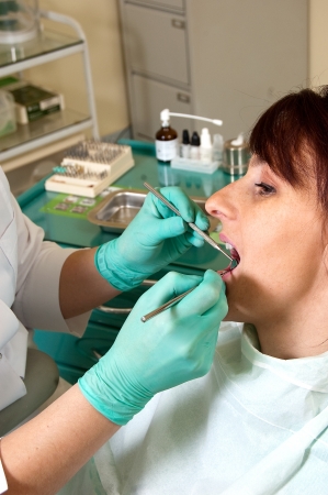 Dental treatment in a young woman in a dentist's officeの写真素材