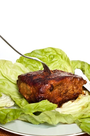 roast pork in tomatoes on the white backgroundの写真素材