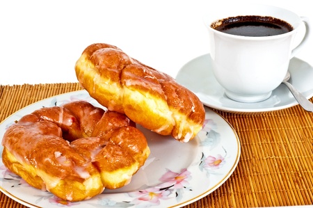 Delicious donuts with coffee for breakfastの写真素材