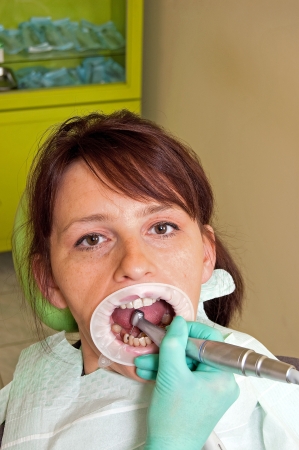 Dental treatment in a young woman in a dentist's officeの写真素材