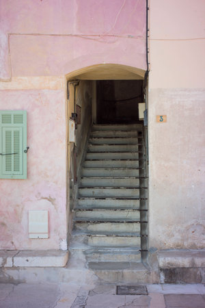 Old doorway and stairs in southern Franceの写真素材
