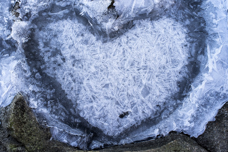 Naturally formed heart in the ice, winterの写真素材