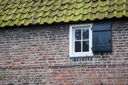 white window on brick wallの写真素材