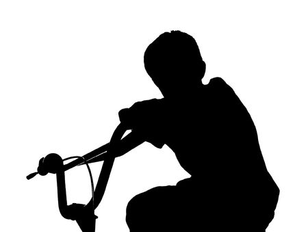 boy silhouette on bikeの写真素材