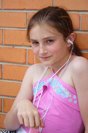 Beautiful girl listening music playerの写真素材