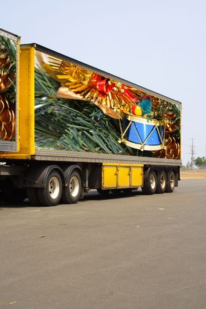 Semi trailer delivering christmas goods. Original photo on trailer by photographerの写真素材