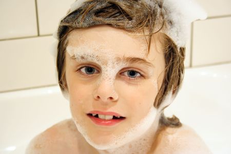 Cute boy in bubble bath