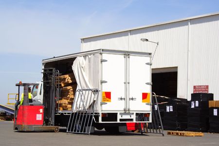 Forklift driver loading truck