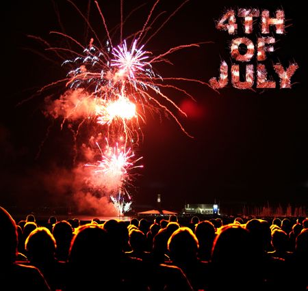 People watch fireworks display for 4th of julyの写真素材