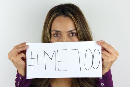 Me too social movement a Latin American Woman holding a me too signの写真素材