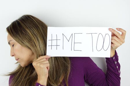 Me too social movement a Latin American Woman holding a me too signの写真素材