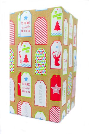 A wrapped Christmas present over white backgroundの写真素材