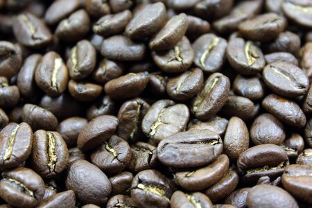 A background of dark roasted coffee beans