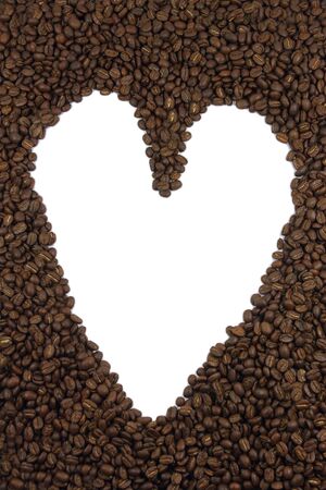Love heart made with dark roasted coffee beansの写真素材