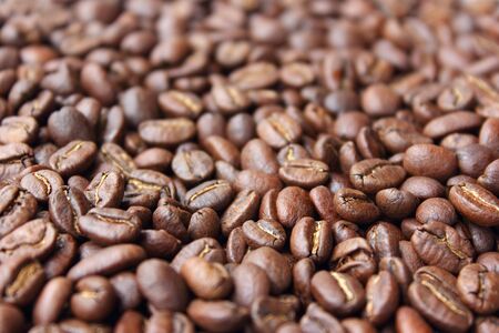 A background of dark roasted coffee beansの写真素材