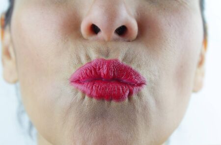 A Woman with puckered lips